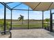 Screened patio overlooking a tranquil waterway at 192 Van Gogh Cv, Bradenton, FL 34212