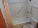 Bathroom features a bathtub, toilet and shower at 219 E Early St, Brooksville, FL 34601