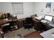 Home office features a work desk, computer, and ample storage at 219 E Early St, Brooksville, FL 34601