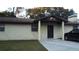 Front view of a single story home with a covered entry at 219 E Early St, Brooksville, FL 34601