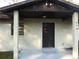 Front view of a single story home with a covered entry at 219 E Early St, Brooksville, FL 34601