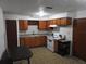 Cozy kitchen featuring wood cabinets and an electric range at 219 E Early St, Brooksville, FL 34601