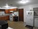 Efficient kitchen with wood cabinets and ample counter space at 219 E Early St, Brooksville, FL 34601