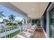 Relaxing balcony overlooking lush tropical landscape at 2208 Avenue A, Bradenton Beach, FL 34217