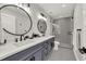 Modern bathroom with double vanity and geometric tile shower at 2208 Avenue A, Bradenton Beach, FL 34217