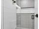 Modern bathroom with geometric tile and glass shower at 2208 Avenue A, Bradenton Beach, FL 34217
