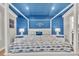 Coastal-themed bedroom with a four-poster bed and blue accent wall at 2208 Avenue A, Bradenton Beach, FL 34217