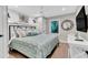 Guest bedroom with coastal decor, king-size bed, and TV at 2208 Avenue A, Bradenton Beach, FL 34217