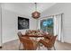 Dining room with a round wooden table and wicker chairs at 2208 Avenue A, Bradenton Beach, FL 34217