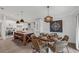 Coastal dining area with round wooden table and wicker chairs at 2208 Avenue A, Bradenton Beach, FL 34217