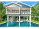 Two-story home with private pool and tropical landscaping at 2208 Avenue A, Bradenton Beach, FL 34217