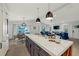Modern kitchen with white cabinets, large island, and open floor plan at 2208 Avenue A, Bradenton Beach, FL 34217