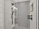 Walk-in shower with geometric tile and glass enclosure at 2208 Avenue A, Bradenton Beach, FL 34217