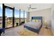 Comfortable bedroom with a city view and ceiling fan at 300 S Pineapple Ave # 801N, Sarasota, FL 34236