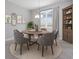 Dining room with round table and wooden cabinetry at 3490 Ikola Ave, North Port, FL 34288