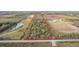 Triangular lot with mature trees and surrounding landscape at 39200 Cook Brown Rd, Punta Gorda, FL 33982