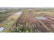 Aerial view of expansive property with multiple ponds at 39200 Cook Brown Rd, Punta Gorda, FL 33982
