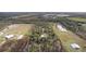 Aerial view showcasing the property's large lot size at 39200 Cook Brown Rd, Punta Gorda, FL 33982
