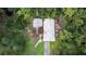 Aerial image showing a property with two rundown buildings and a small yard at 39200 Cook Brown Rd, Punta Gorda, FL 33982