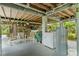 Unfinished basement area with laundry hookups and room for storage at 39200 Cook Brown Rd, Punta Gorda, FL 33982