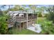 Elevated home with large deck and patio area, perfect for relaxing at 39200 Cook Brown Rd, Punta Gorda, FL 33982