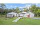 Two-building property with large yard and separate storage unit at 39200 Cook Brown Rd, Punta Gorda, FL 33982