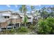 Elevated home with wrap-around deck, offering ample outdoor space at 39200 Cook Brown Rd, Punta Gorda, FL 33982