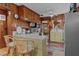Kitchen with wood cabinets, microwave, and a breakfast bar area at 39200 Cook Brown Rd, Punta Gorda, FL 33982