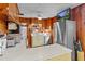 Kitchen with wood cabinets, stainless steel appliances, and a breakfast bar at 39200 Cook Brown Rd, Punta Gorda, FL 33982