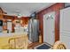 Bright kitchen features stainless steel appliances and wood paneling at 39200 Cook Brown Rd, Punta Gorda, FL 33982