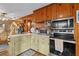 Charming kitchen with wood cabinets and stainless steel appliances at 39200 Cook Brown Rd, Punta Gorda, FL 33982