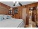 Spacious main bedroom with wood-paneled walls at 39200 Cook Brown Rd, Punta Gorda, FL 33982