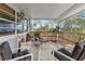 Relaxing screened porch offers wooded views and comfortable seating at 39200 Cook Brown Rd, Punta Gorda, FL 33982