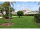 Landscaped front yard with lush green grass at 4166 Corte La Vista Vis, Sarasota, FL 34238