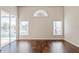 Living area with hardwood floors and sliding doors to pool at 4166 Corte La Vista Vis, Sarasota, FL 34238