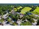 Aerial view of clubhouse, parking, and golf course at 4532 Longwater Chase # 37, Sarasota, FL 34235