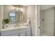 Modern bathroom with updated vanity, large mirror, and walk-in shower at 4532 Longwater Chase # 37, Sarasota, FL 34235