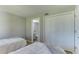 Bright bedroom with two twin beds and private bathroom access at 4532 Longwater Chase # 37, Sarasota, FL 34235