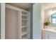 Spacious closet with white shelves and hanging rod at 4532 Longwater Chase # 37, Sarasota, FL 34235
