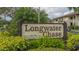 Longwater Chase community entrance sign at 4532 Longwater Chase # 37, Sarasota, FL 34235