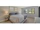 Spacious main bedroom with a comfortable bed and plenty of natural light at 4532 Longwater Chase # 37, Sarasota, FL 34235