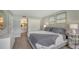 Main bedroom with king bed, dresser, and view of bathroom at 4532 Longwater Chase # 37, Sarasota, FL 34235