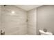 Updated shower with modern grey tile and built-in shelf at 4532 Longwater Chase # 37, Sarasota, FL 34235