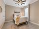 Bright bedroom with a comfortable bed and ceiling fan at 4758 Tortona Ct, Lakewood Ranch, FL 34211