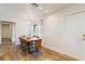 Dining area with a wood table and leather chairs near kitchen at 4820 Sunday Ct, Sarasota, FL 34235