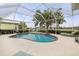 Relaxing pool with screened enclosure and lake view at 503 Lake Of The Woods Dr, Venice, FL 34293