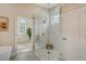 Bright bathroom features a walk-in shower and large tiles at 5097 Faberge Pl, Sarasota, FL 34233