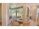 Charming breakfast nook with a glass-top table, providing natural light and a view of the outdoors at 5097 Faberge Pl, Sarasota, FL 34233