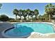 Sparkling community pool featuring clear blue water and palm trees at 5097 Faberge Pl, Sarasota, FL 34233