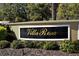 Elegant Villa Rosa community sign surrounded by manicured landscaping at 5097 Faberge Pl, Sarasota, FL 34233